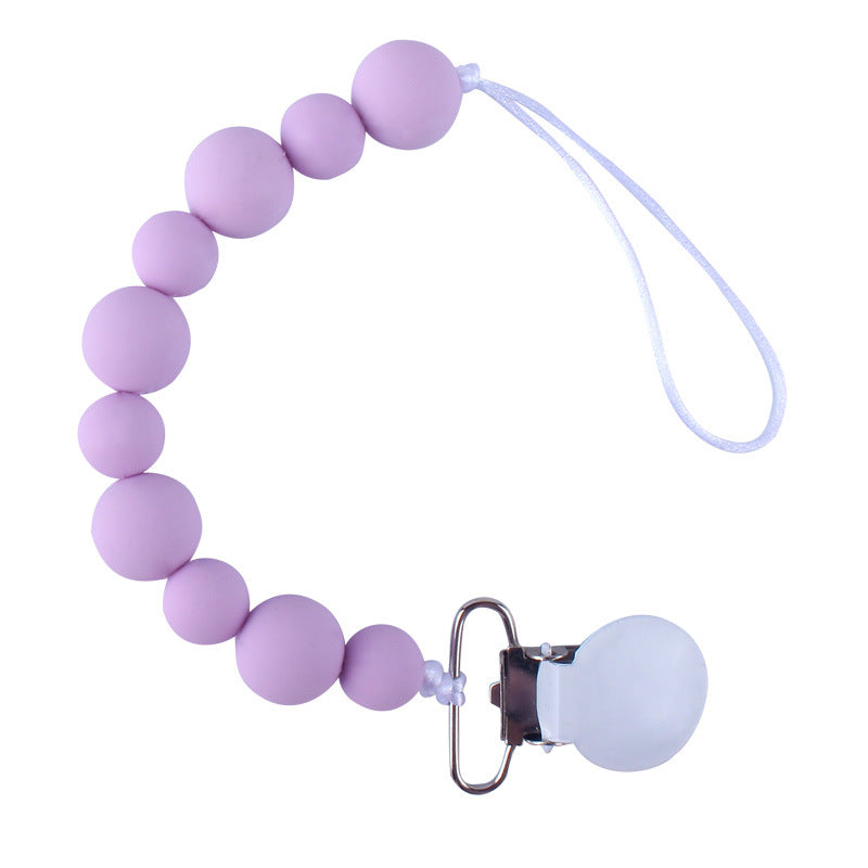 Purple silicone pacifier clip on a white background