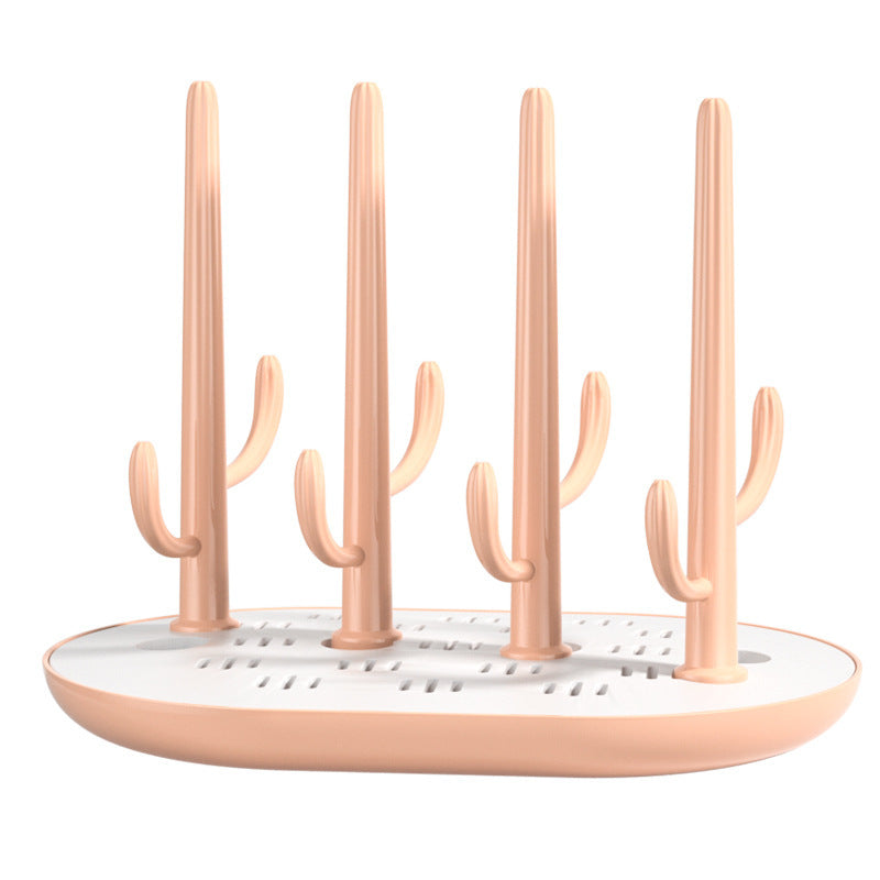 Drying rack designed like a cactus with multiple hooks on a white background