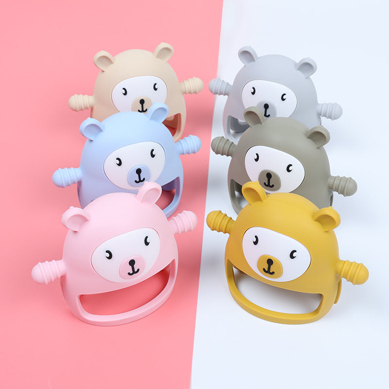Set of six bear-shaped teethers in different colors on a pink and white background