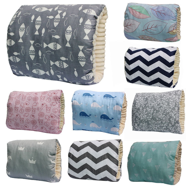 Collection of patterned arm pillows with different designs on a white background