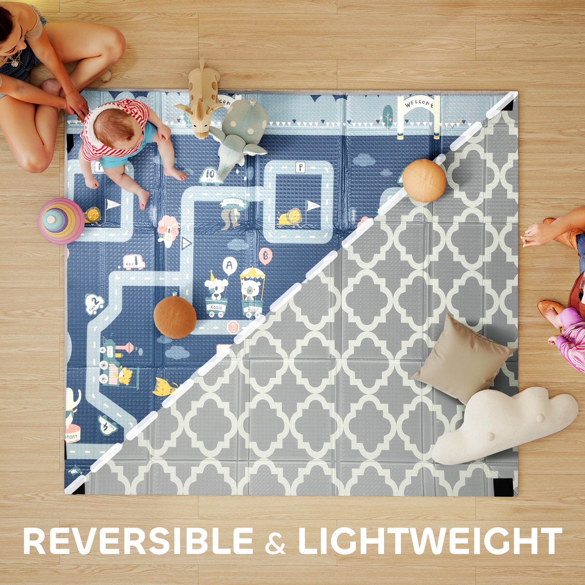 Children playing on a reversible and lightweight play mat with toys on a wooden floor.